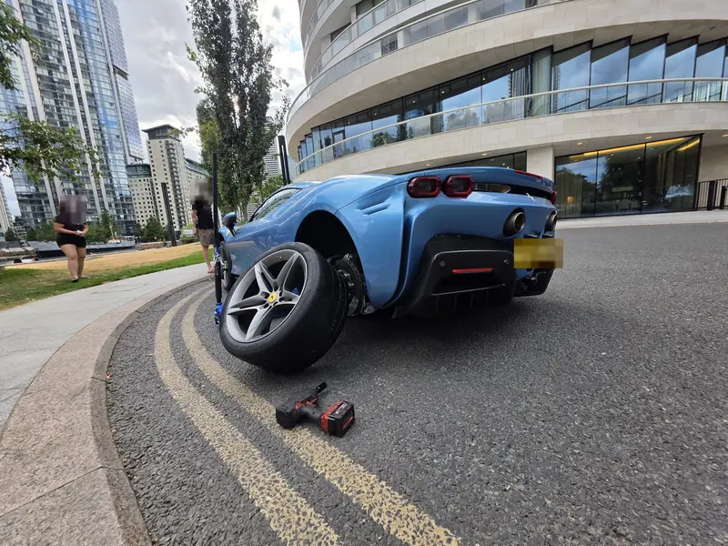 Mobile tyre fitting on a supercar at the roadside in Ilford